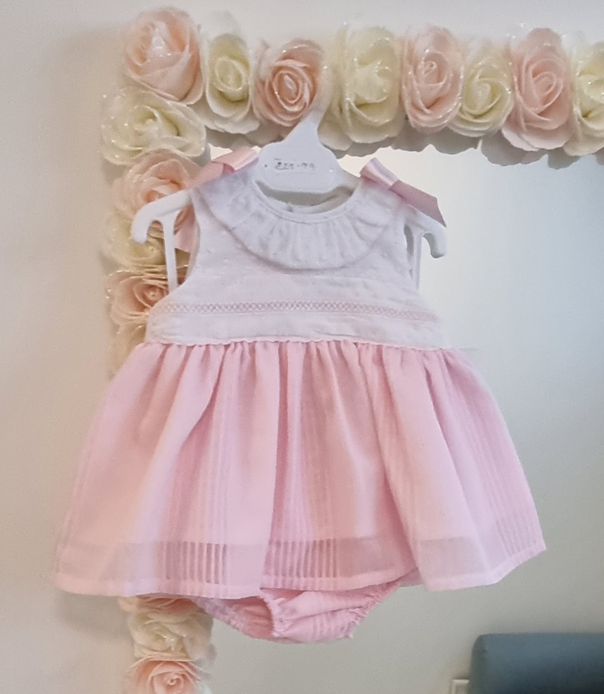 Pink and white frilly dress with pants